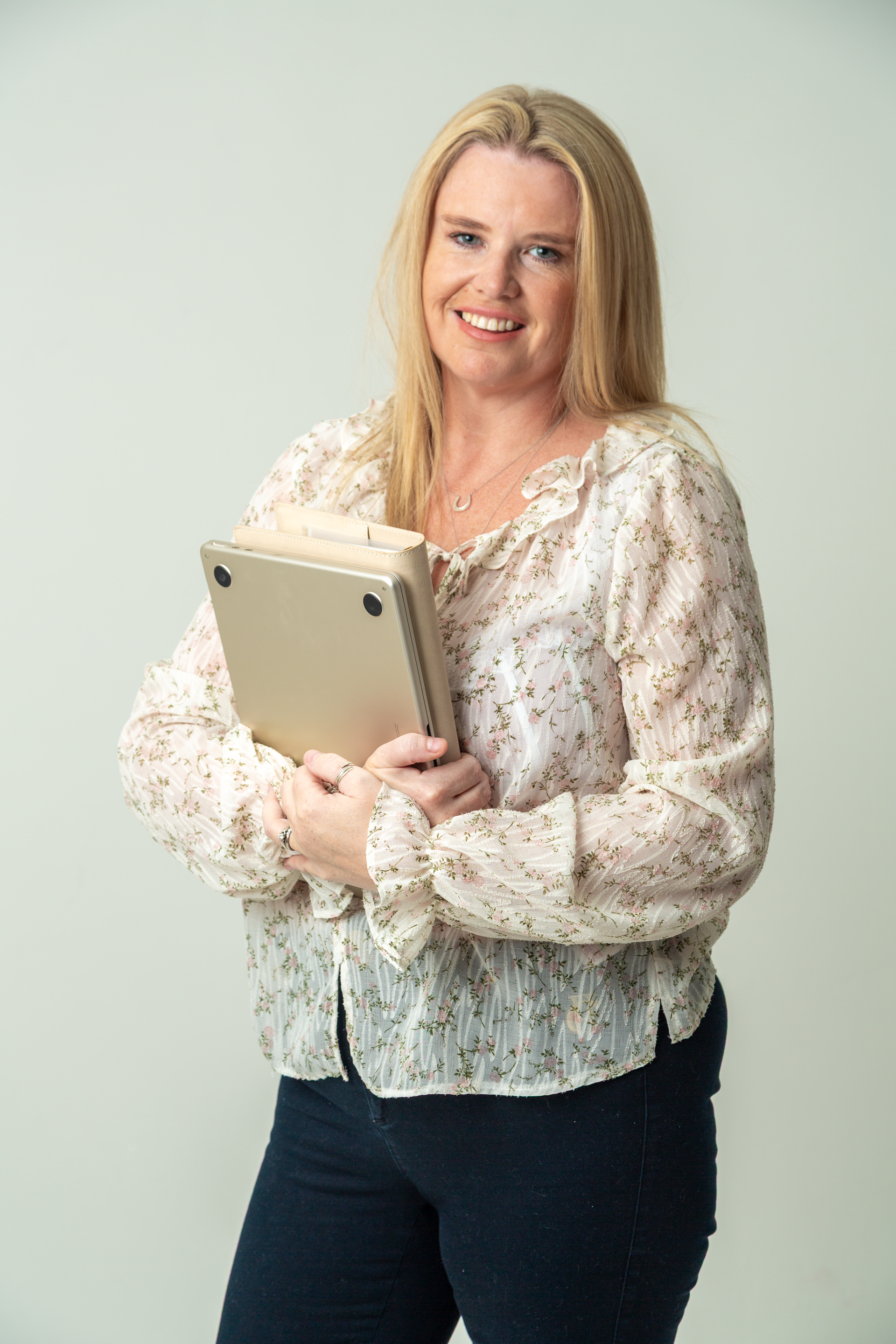 Erica from Virtual EA holding a tablet